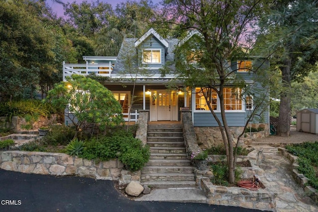 12617 Koenigstein Rd, Santa Paula, CA 93060 - view of front of property with covered porch, stairs, an outdoor structure, and a shed