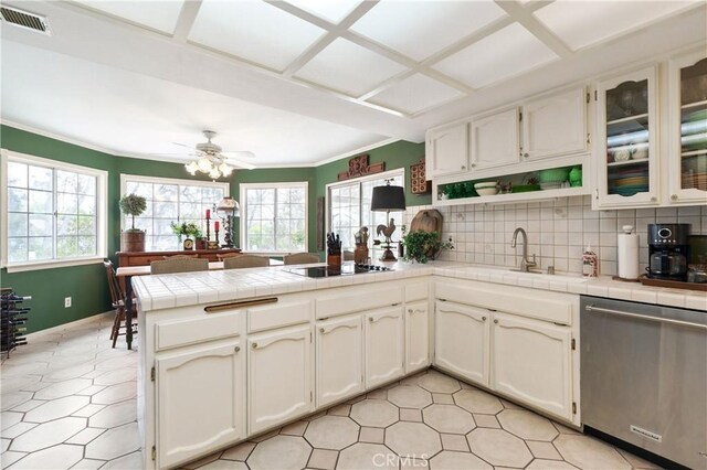 31065 Avenida Del Reposo, Temecula, CA 92591 - kitchen with dishwasher, black electric cooktop, a peninsula, a wealth of natural light, and visible vents
