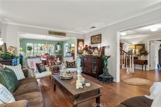 31065 Avenida Del Reposo, Temecula, CA 92591 - living area with visible vents, ornamental molding, wood finished floors, stairway, and a notable chandelier