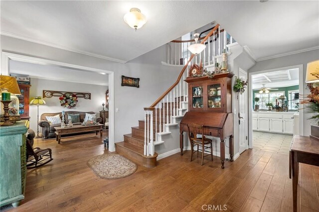 31065 Avenida Del Reposo, Temecula, CA 92591 - foyer with stairs, crown molding, baseboards, and hardwood / wood-style flooring