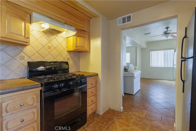 9408 Poplar Ave, Fontana, CA 92335 - kitchen with gas stove, under cabinet range hood, backsplash, a ceiling fan, and light brown cabinetry