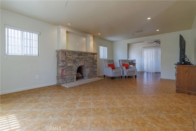 9408 Poplar Ave, Fontana, CA 92335 - living area with ceiling fan, a fireplace, recessed lighting, light tile patterned flooring, and baseboards