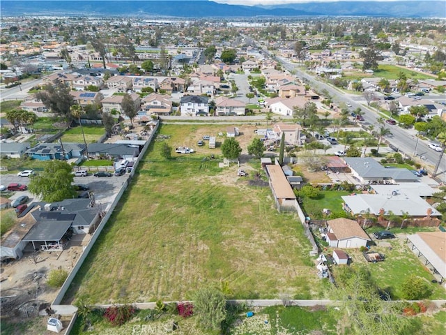 9408 Poplar Ave, Fontana, CA 92335 - aerial overview of property's location featuring a mountain backdrop and nearby suburban area
