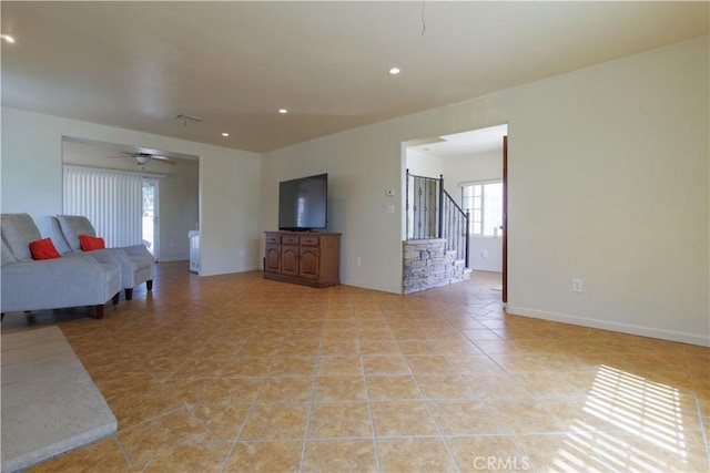 9408 Poplar Ave, Fontana, CA 92335 - living room with a ceiling fan, stairway, recessed lighting, light tile patterned floors, and baseboards