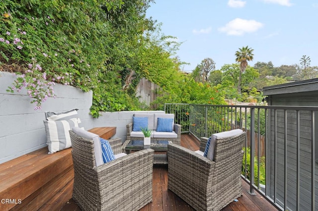 wooden deck featuring an outdoor living space