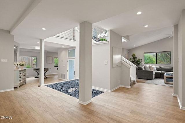 foyer with recessed lighting, light wood-style flooring, and baseboards