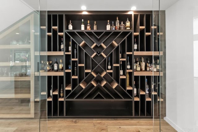 wine room with wood finished floors