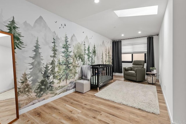 5186 Maynard St, San Diego, CA 92122 - bedroom featuring wood finished floors, a skylight, and recessed lighting