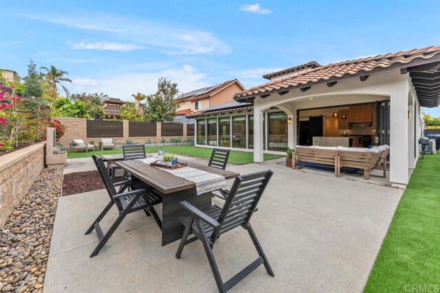 5186 Maynard St, San Diego, CA 92122 - view of patio with outdoor dining area and a sunroom