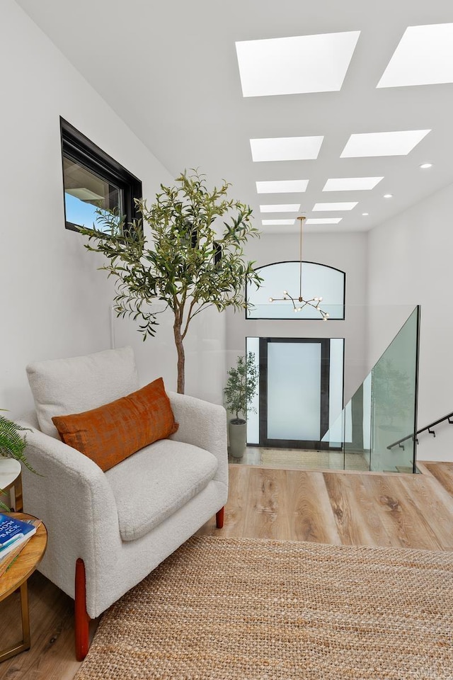 5186 Maynard St, San Diego, CA 92122 - foyer entrance with wood finished floors, a skylight, and recessed lighting