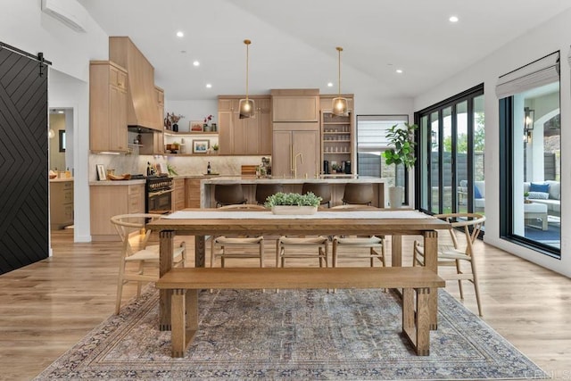 5186 Maynard St, San Diego, CA 92122 - dining space with light wood-style flooring, lofted ceiling, and recessed lighting