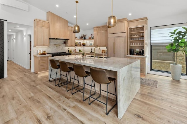 5186 Maynard St, San Diego, CA 92122 - kitchen with light brown cabinets, open shelves, paneled built in fridge, backsplash, and a kitchen bar