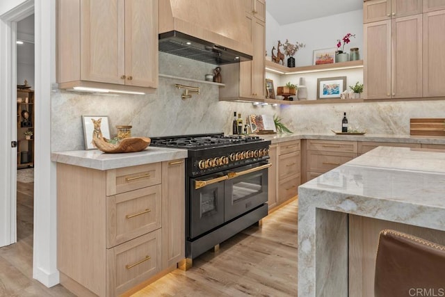 5186 Maynard St, San Diego, CA 92122 - kitchen featuring range with two ovens, light brown cabinetry, light wood-style flooring, and backsplash