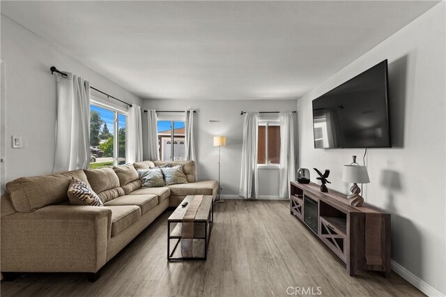 11525 Corby Ave, Norwalk, CA 90650 - living room featuring wood finished floors and baseboards