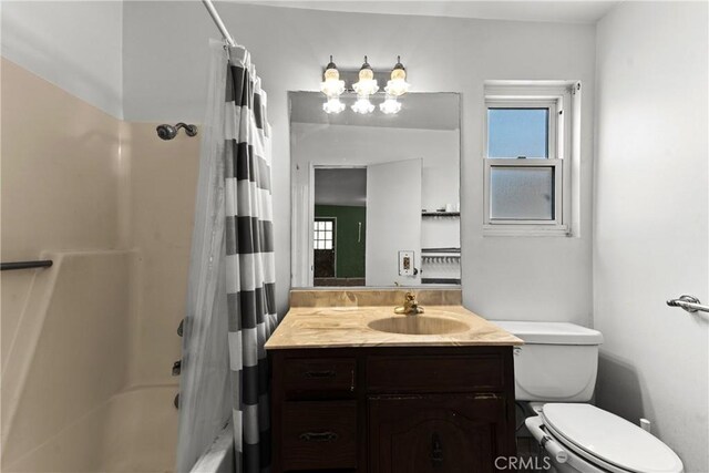 11525 Corby Ave, Norwalk, CA 90650 - bathroom featuring toilet, vanity, and shower / tub combo