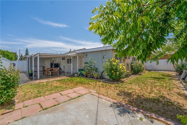 11525 Corby Ave, Norwalk, CA 90650 - back of property with a patio area and stucco siding