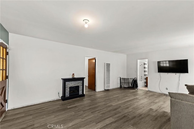 11525 Corby Ave, Norwalk, CA 90650 - unfurnished living room featuring a heating unit, wood finished floors, and a fireplace
