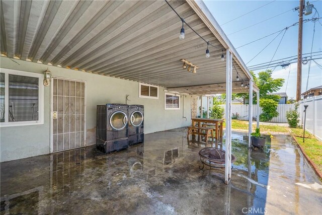 11525 Corby Ave, Norwalk, CA 90650 - fenced backyard with washer and dryer, a patio area, and a fire pit