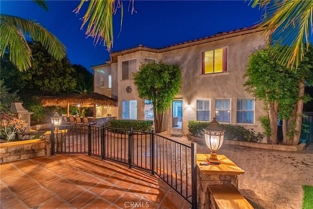 991 Clear Sky Pl, Simi Valley, CA 93065 - view of front facade with stucco siding and a patio area