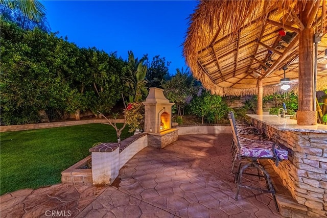 991 Clear Sky Pl, Simi Valley, CA 93065 - view of patio with a lit fireplace