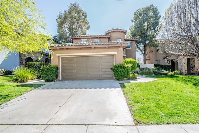 mediterranean / spanish home featuring concrete driveway, stucco siding, a tiled roof, a front yard, and a garage