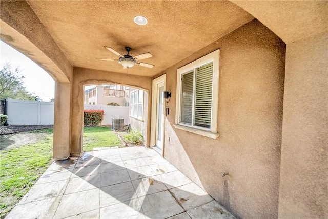 view of patio / terrace with fence, cooling unit, and ceiling fan