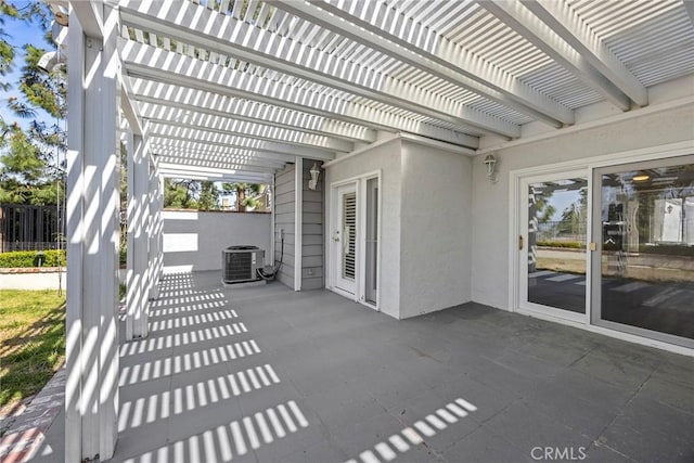 view of patio with a pergola, central AC unit, and fence