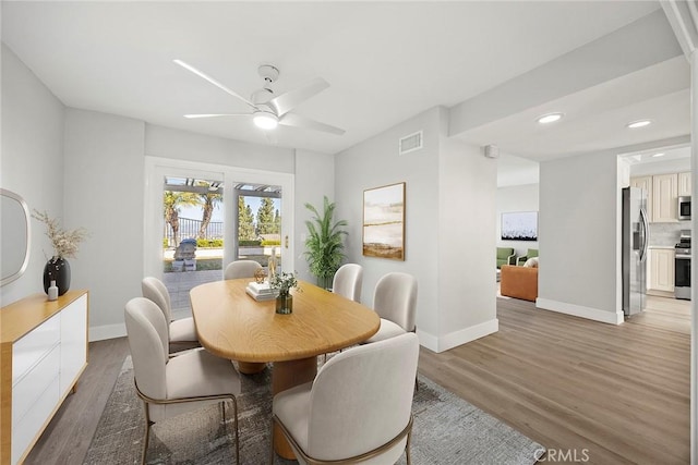 dining space featuring light wood finished floors, baseboards, visible vents, recessed lighting, and a ceiling fan
