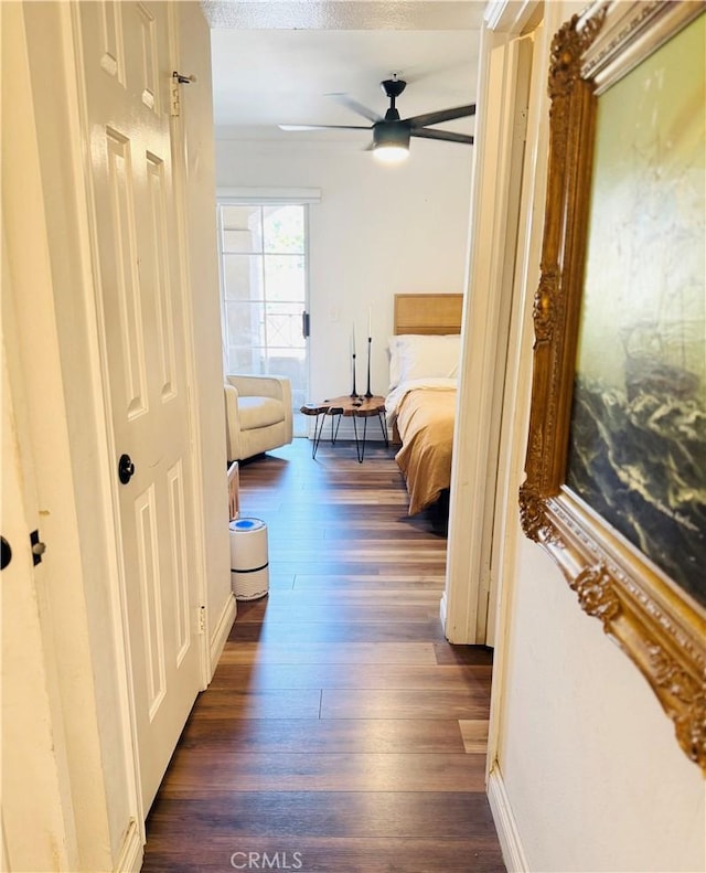 1775 Ohio Ave Unit 213, Long Beach, CA 90804 - bedroom with dark wood-style floors, a ceiling fan, and baseboards