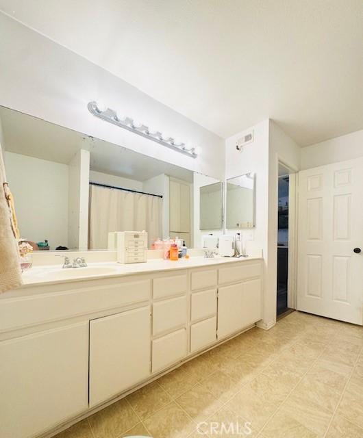1775 Ohio Ave Unit 213, Long Beach, CA 90804 - bathroom featuring double vanity and a sink