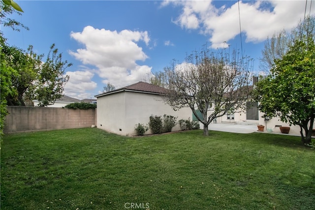 view of yard with fence and a patio area