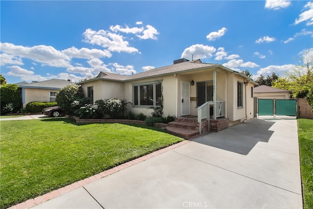 single story home with stucco siding, a gate, a front lawn, and concrete driveway