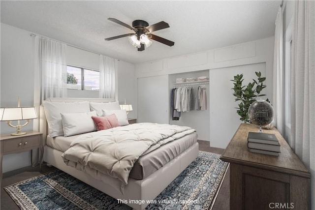 bedroom with a ceiling fan and a closet
