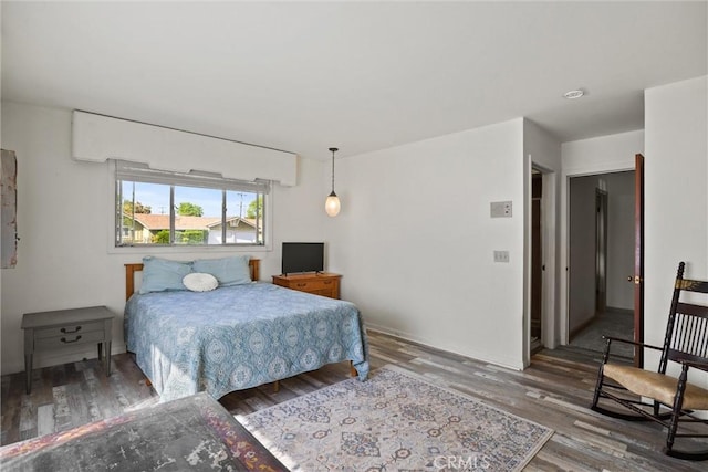 bedroom with wood finished floors