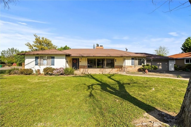 single story home with a garage, driveway, a chimney, and a front lawn