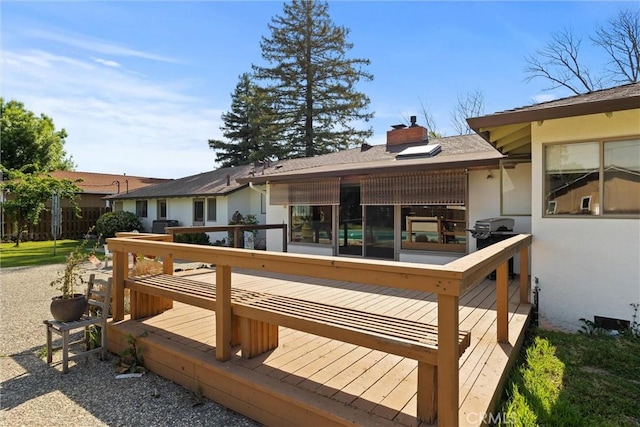 wooden terrace with grilling area