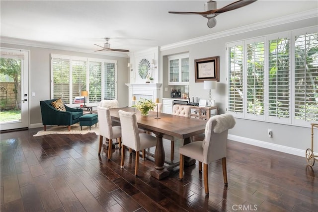 27705 Essex Pl, Valencia, CA 91354 - dining space featuring a ceiling fan, crown molding, dark wood finished floors, and a fireplace
