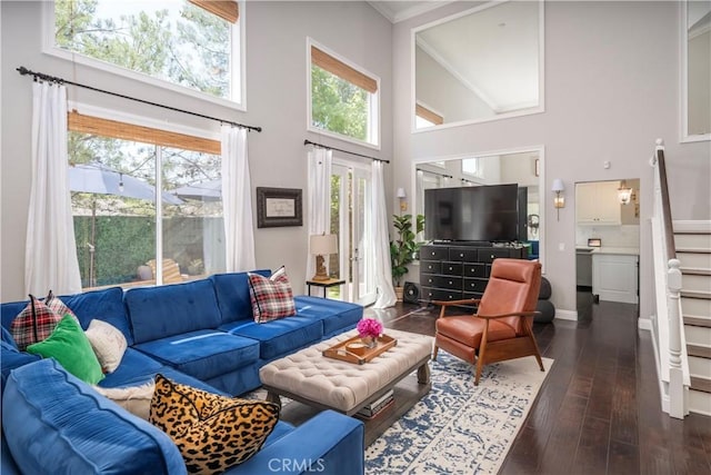 27705 Essex Pl, Valencia, CA 91354 - living room featuring stairs, a towering ceiling, dark wood finished floors, and crown molding
