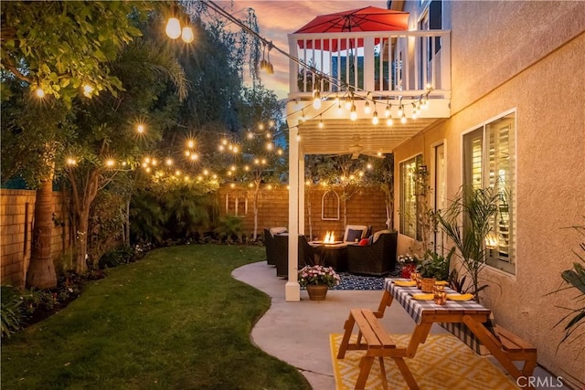 27705 Essex Pl, Valencia, CA 91354 - fenced backyard featuring a fire pit, a balcony, and a patio