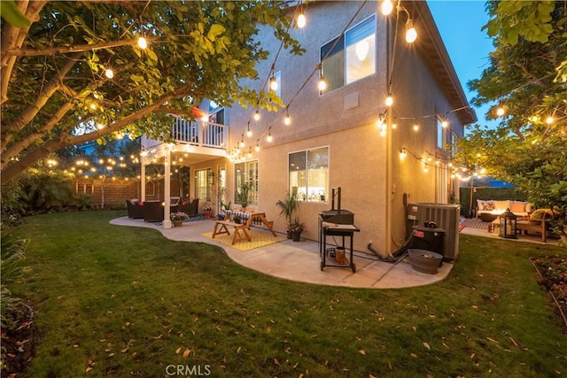 27705 Essex Pl, Valencia, CA 91354 - back of house featuring outdoor lounge area, a balcony, stucco siding, and a lawn