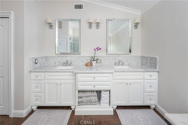 27705 Essex Pl, Valencia, CA 91354 - full bath featuring double vanity, ornamental molding, wood finished floors, tasteful backsplash, and lofted ceiling