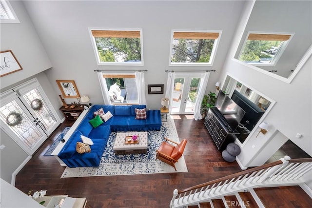 27705 Essex Pl, Valencia, CA 91354 - living area featuring french doors, a towering ceiling, plenty of natural light, and wood finished floors