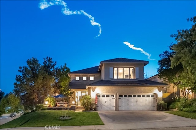 27705 Essex Pl, Valencia, CA 91354 - traditional-style home featuring a garage, stucco siding, a front lawn, and concrete driveway