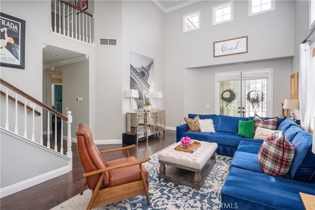 27705 Essex Pl, Valencia, CA 91354 - living area featuring wood finished floors, a towering ceiling, stairway, ornamental molding, and french doors