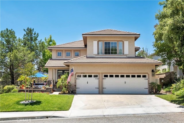 27705 Essex Pl, Valencia, CA 91354 - traditional home with a garage, stucco siding, driveway, and a front yard