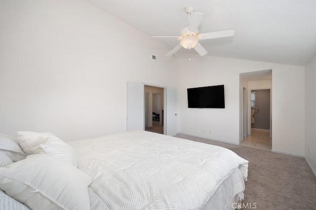 bedroom with light carpet, baseboards, visible vents, a ceiling fan, and high vaulted ceiling
