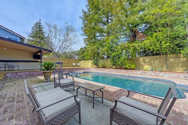 view of pool featuring a fenced backyard, a patio area, and a fenced in pool