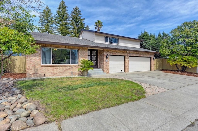 traditional-style home with driveway, a front yard, fence, brick siding, and a garage