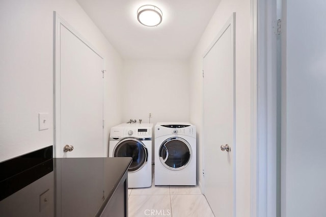 laundry area featuring washer and clothes dryer and laundry area