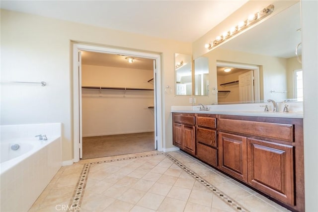 36368 Par Ln, Beaumont, CA 92223 - bathroom featuring double vanity, tiled bath, a walk in closet, and tile patterned flooring